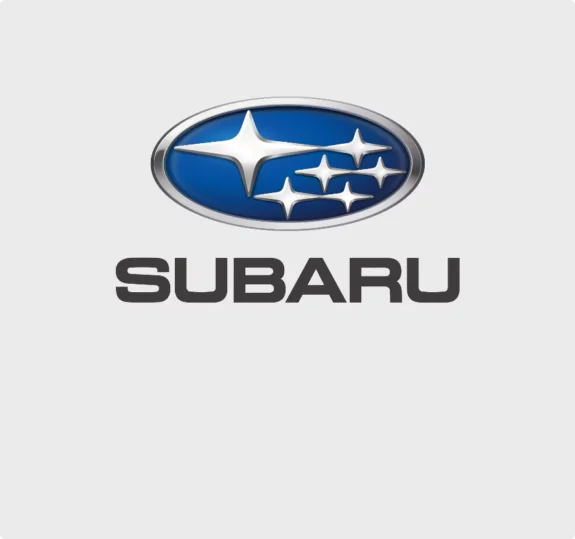 Subarus logotyp med blå bakgrund och sex silverstjärnor.